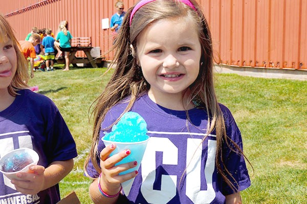 Camp U campers outside eating snow cones